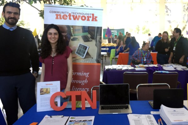 Volunteers Ahmed Abrash and Bendi Yilmaz staffing CTN table at Housing Expo