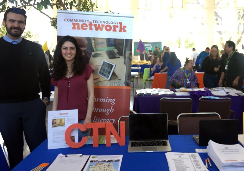 Volunteers Ahmed Abrash and Bendi Yilmaz staffing CTN table at Housing Expo