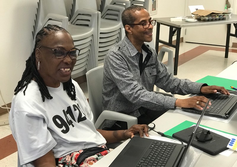 Two students participating in a laptop class in the Bayview of San Francisco