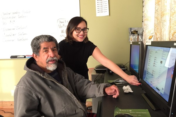 Photo of volunteer Anna and learner Fernando